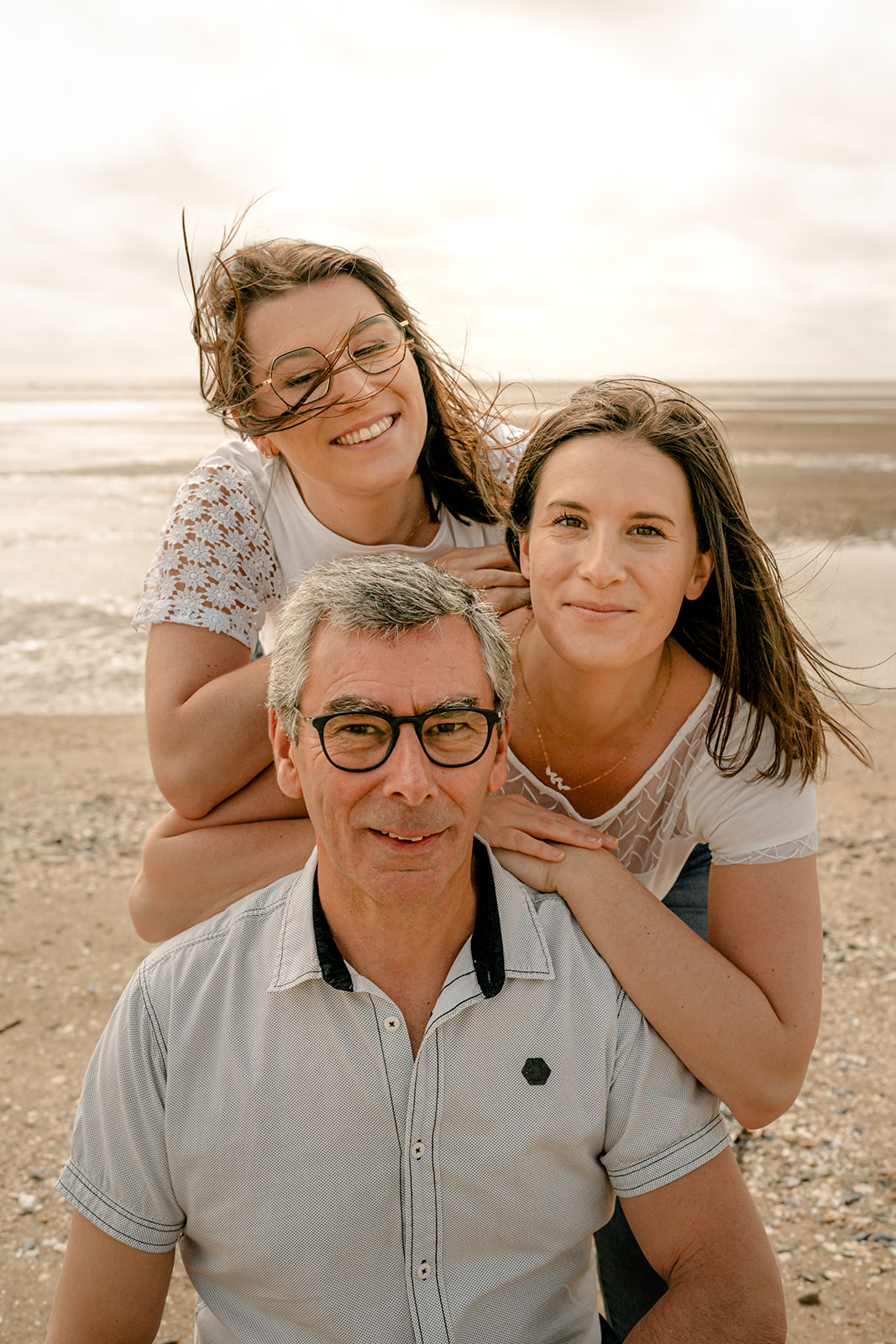 photo de famille sur la plage, carrelets