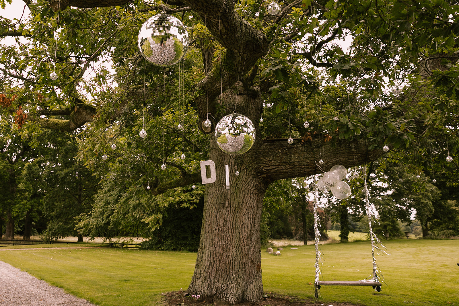 disco ball on tree at wedding