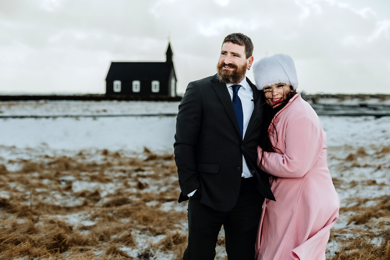 Married couple is walking back to the hotel after their wedding ceremony in Iceland