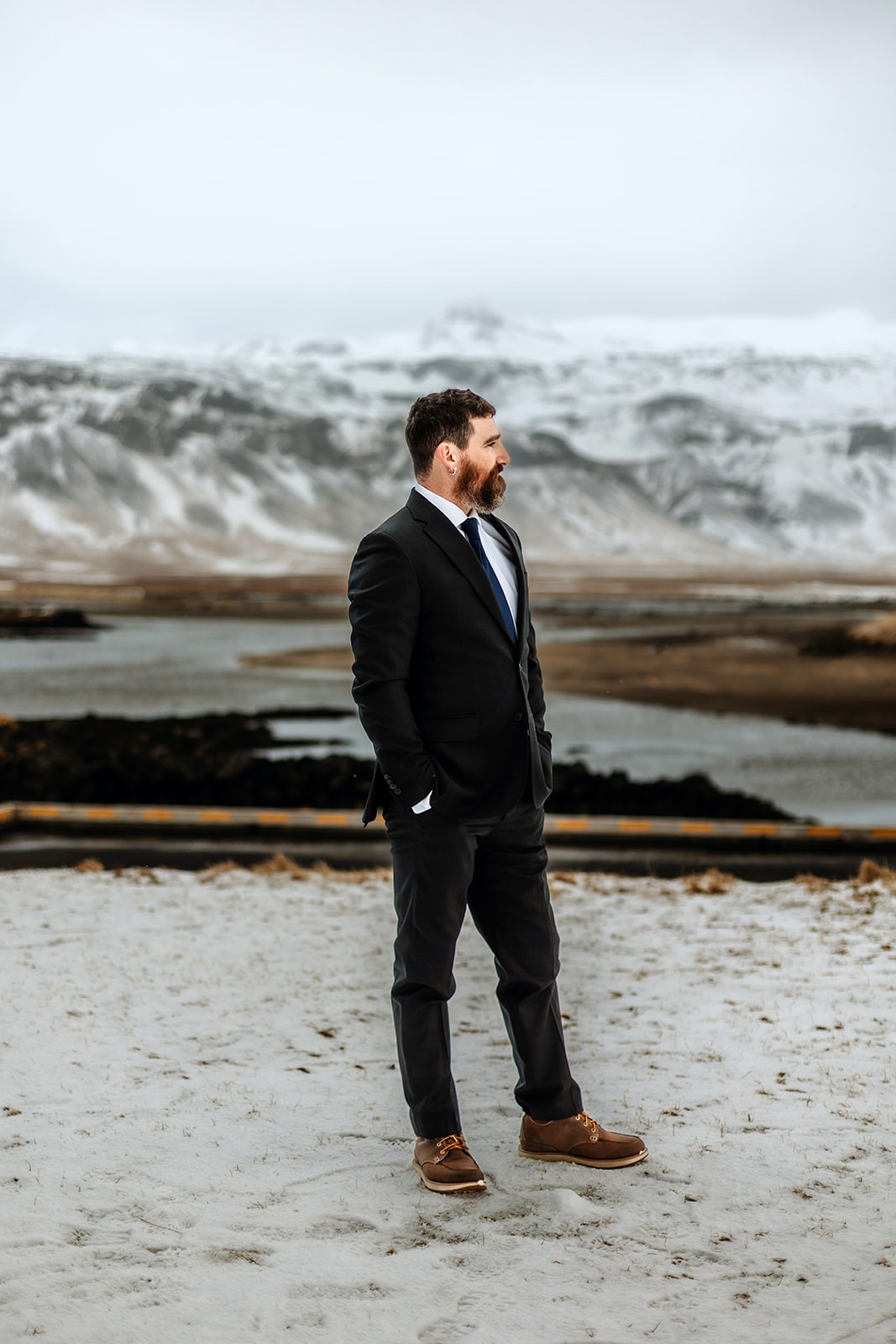 Wedding photography in the snowy winter landscape with mountains in Iceland