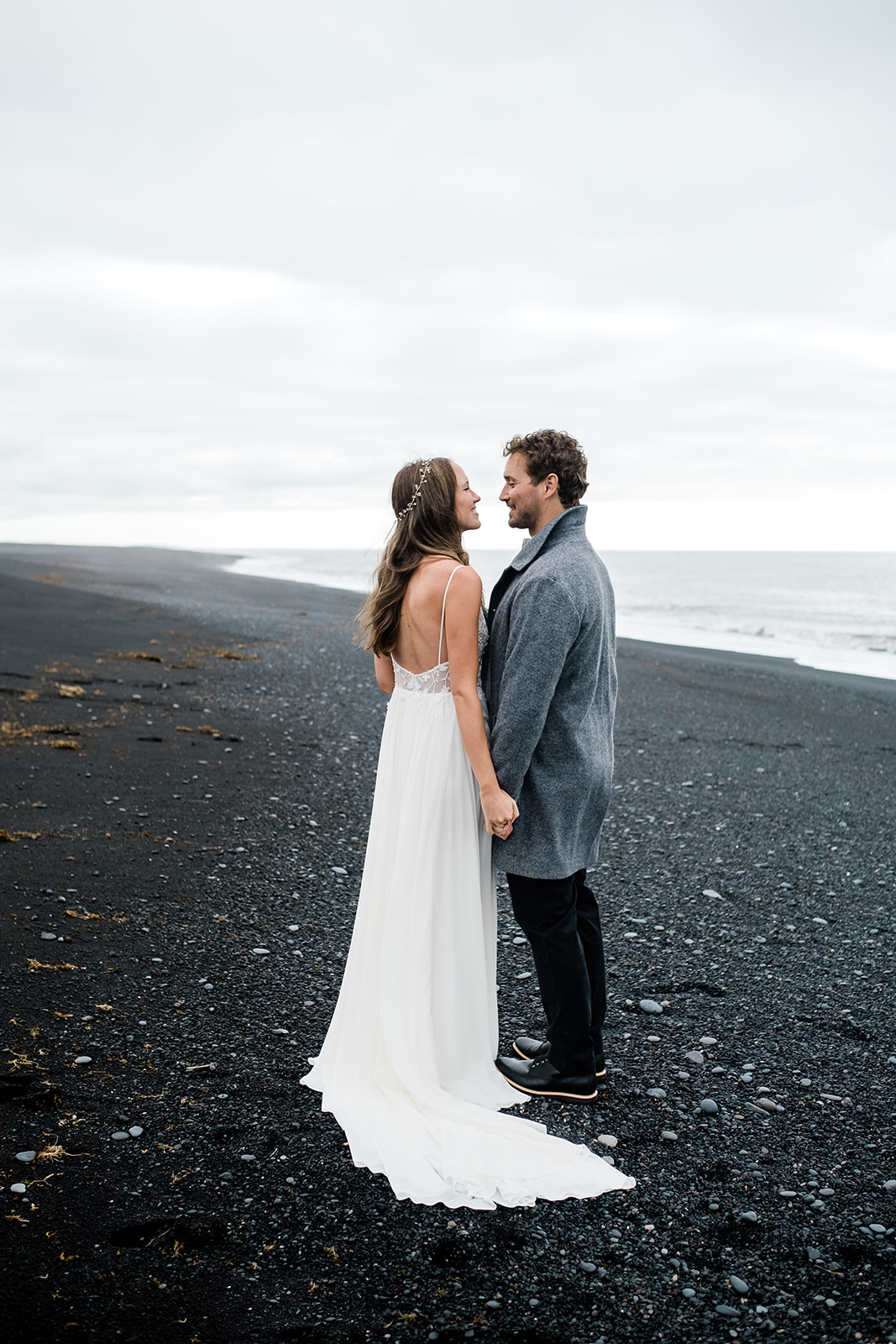 beautiful couple "just married" in Iceland on a black sand beach