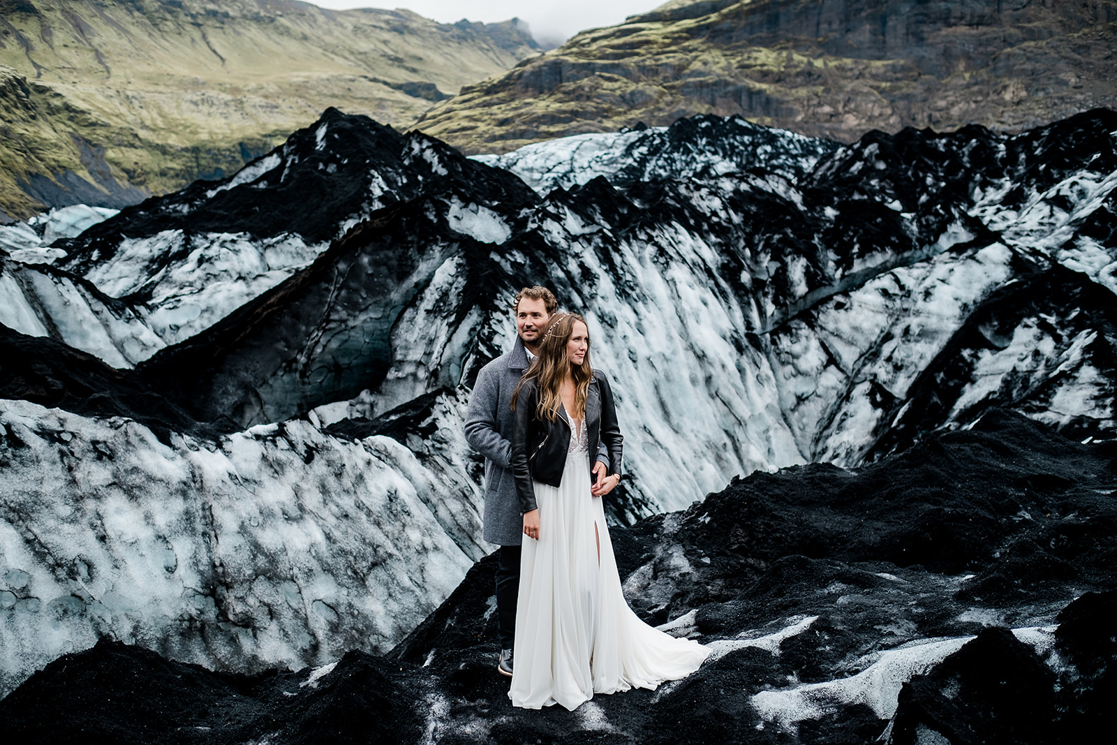 just married couple in front of Sólheimajökull glacier in Iceland