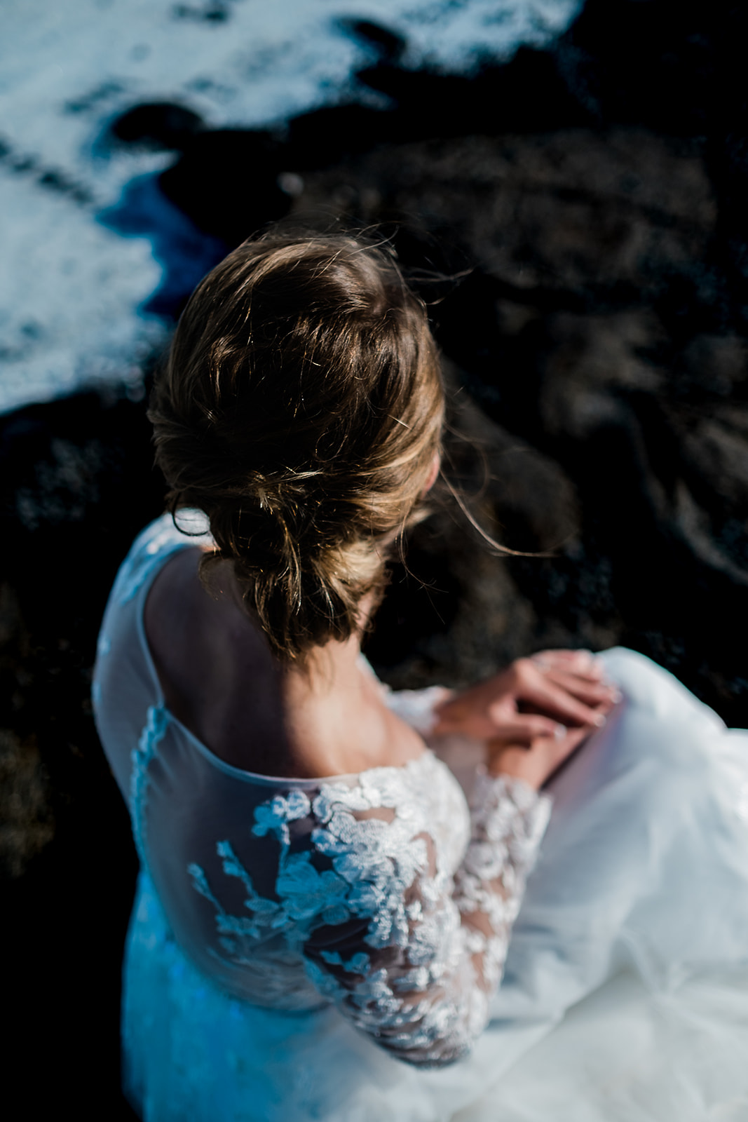 A stunning bride posing at the Blue Lagoon in Iceland during her Ethereal Summer Elopement at Reykjanes Peninsula