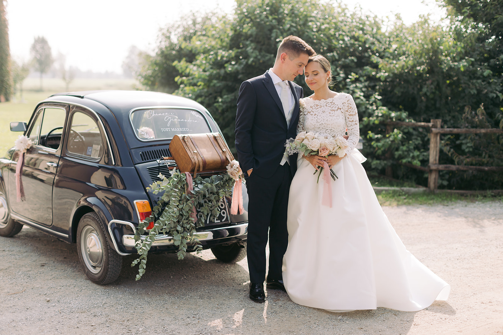 wedding couple with old fiat car